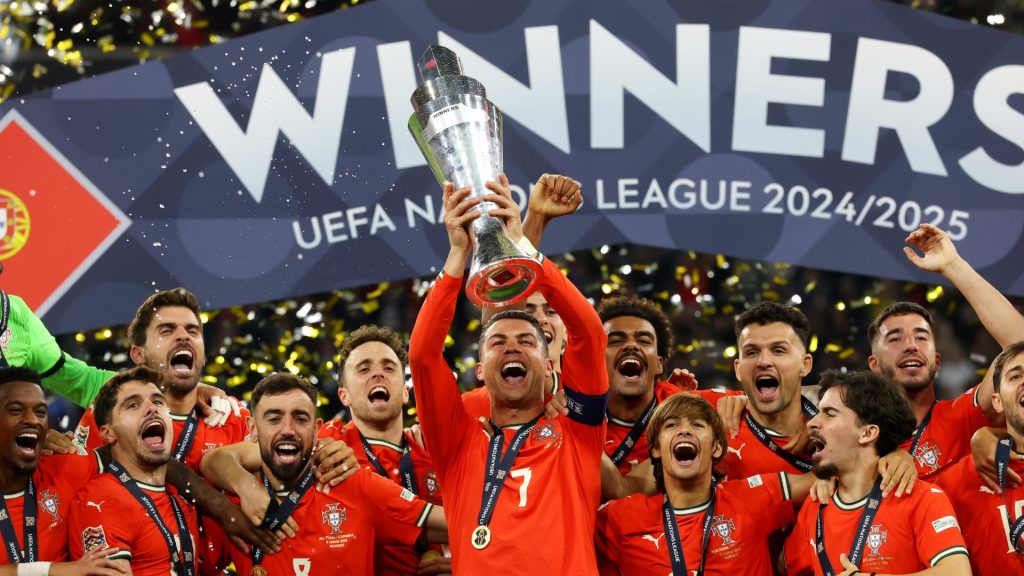 Cristiano Ronaldo of Portugal lifts the UEFA Nations League trophy after his team's victory in the UEFA Nations League 2025 final match between Portugal and Spain at Munich Football Arena on June 08, 2025 in Munich, Germany